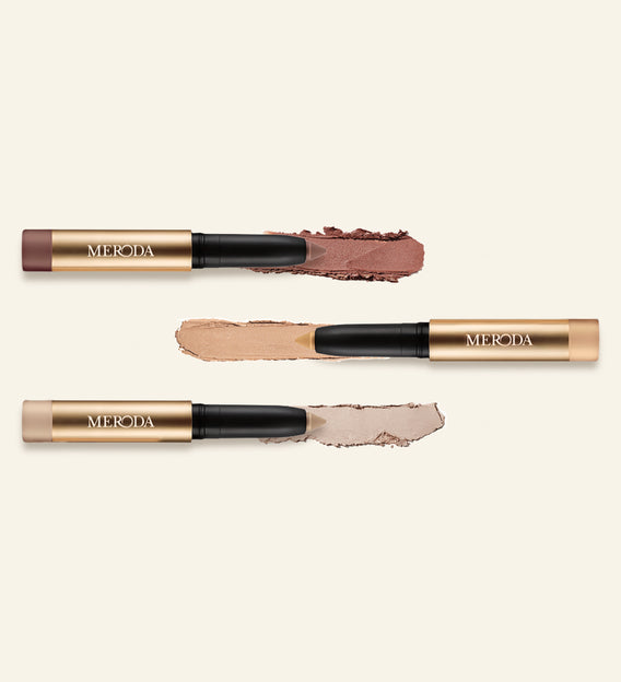 Mini Eye Shimmer Set met drie gouden Eye Perfecting Shimmer Sticks en glinsterende, romige swatches
