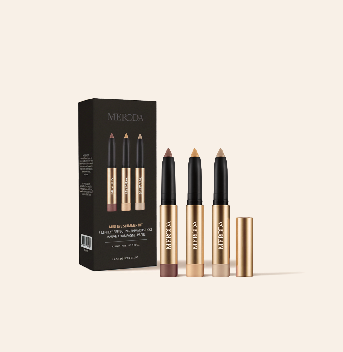 Mini Eye Shimmer Set met drie gouden sticks in Mauve, Champagne en Pearl naast de zwarte merkdoos.